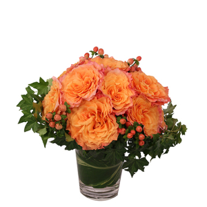  - Flirty Free Spirit is a beautiful mixture of dreamy orange and blushing pink flowers! With a stunning wreath of ivy, these dozen roses are a decadent masterpiece waiting to romance that special someone in your life. Send this flirty arrangement to ma...