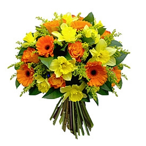  - Compact round bouquet of yellow flowers, highlighted with orange and a hint of greenery.