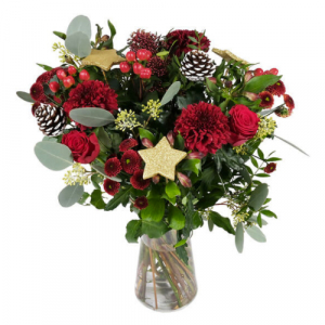  - A precious bouquet with a classic shape and holiday theme. Flowers in red tones, beautiful foliage, pine cones and gold ornaments for a sparkling creation to give this year to mark your wishes with Christmas magic.  Please note vase not included
