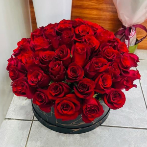  - Arrangement of red roses in a box.