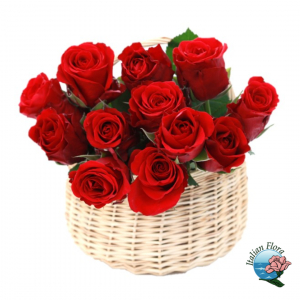  - 12 Red roses in a basket with foliage.