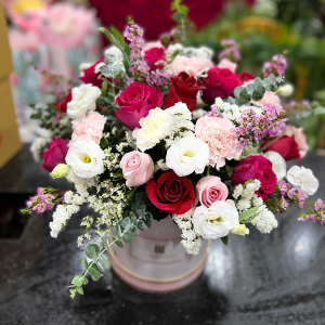  - Handtied in reds, pinks and whites in a box.
