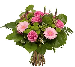  - A round bouquet composed of roses and other seasonal flowers in shades of pink and green accented with greenery.      