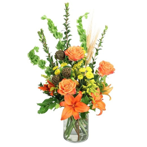 - Bring the beauty of the setting sun indoors with this striking arrangement! The stunning orange roses, lilies, and yellow button poms contrast gorgeously against the lovely greenery, making Vivid Sunset a striking image. This delightful bouquet is pe...
