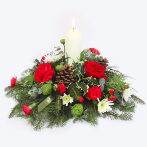  - A glowing Christmas centrepiece with candle, flowers and foliage — handmade to light up your festive table.
